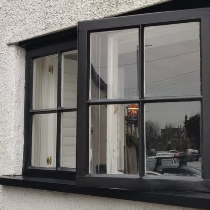 Window and shutters repainted with crisp precision